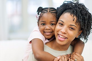 smiling mom and daughter